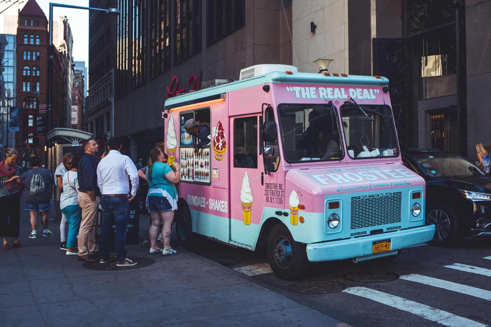 Food truck in the big city with a long order line